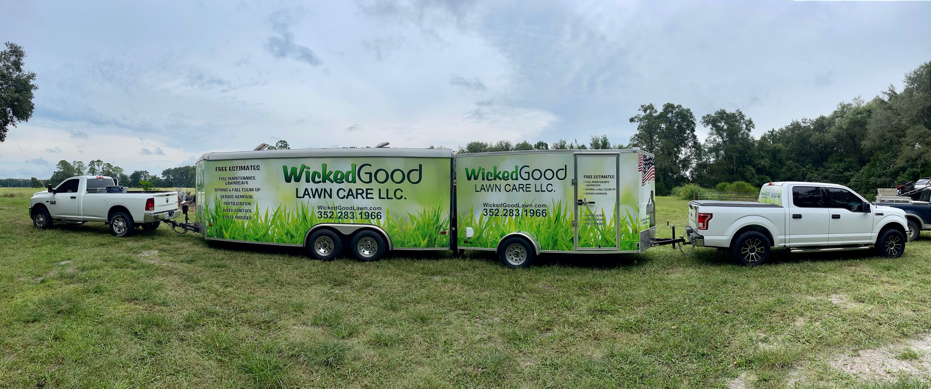 Full Wicked Good Lawn Care fleet — both trucks and branded trailers